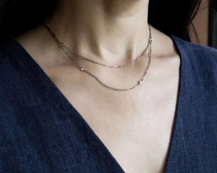 Necklaces Early 20th Century Cartier Platinum and Diamond Chain Bell Bird Antiques